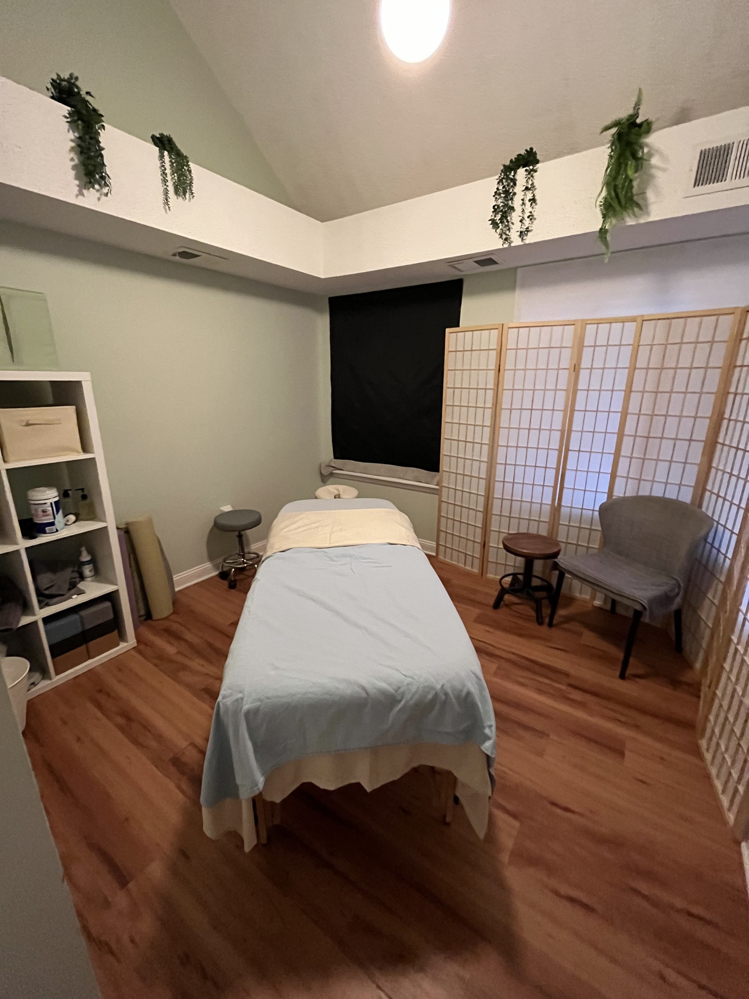 Studio space with massage room visible